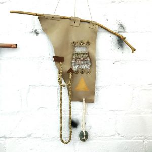 Leather wall hanging found objects